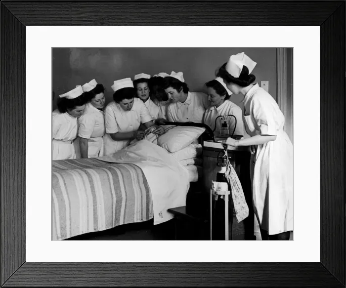 Framed Print : State hospital nurses learning how to adminisyer oxygen by spectable frames