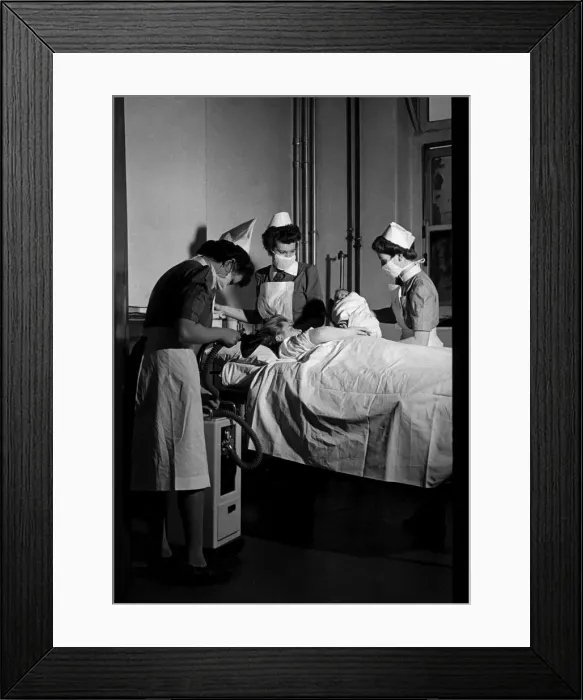 Framed Print : Midwives deliver a new born baby inside thew Labour ward at the British Hospital for Framed Print : Midwives deliver a new born baby inside thew Labour ward at the British Hospital for