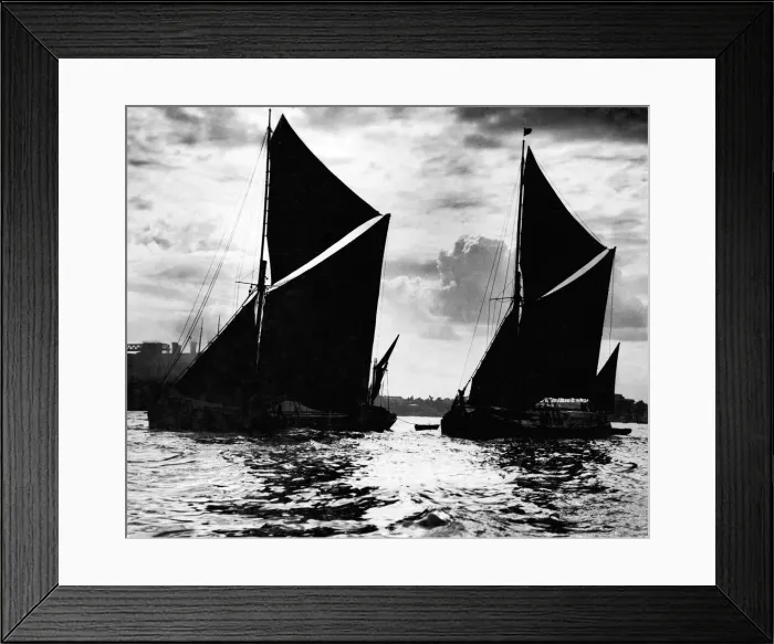 Framed Print : Two Thames Barges leaving the London Docks with the high tide on a summers evening