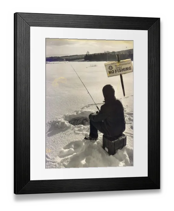 Framed Print : Eskimo style fishing in this winter wonderland at Kielder when the lake froze over in