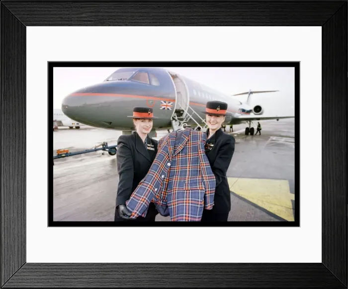 Framed Print : Rod Stewart tartan jacket December 1998 held by British Midland air stewardesses