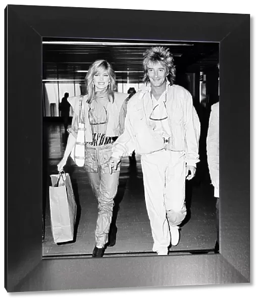 Rod Stewart Rock Singer Songwriter at Heathrow with his girlfriend Kelly Emberg