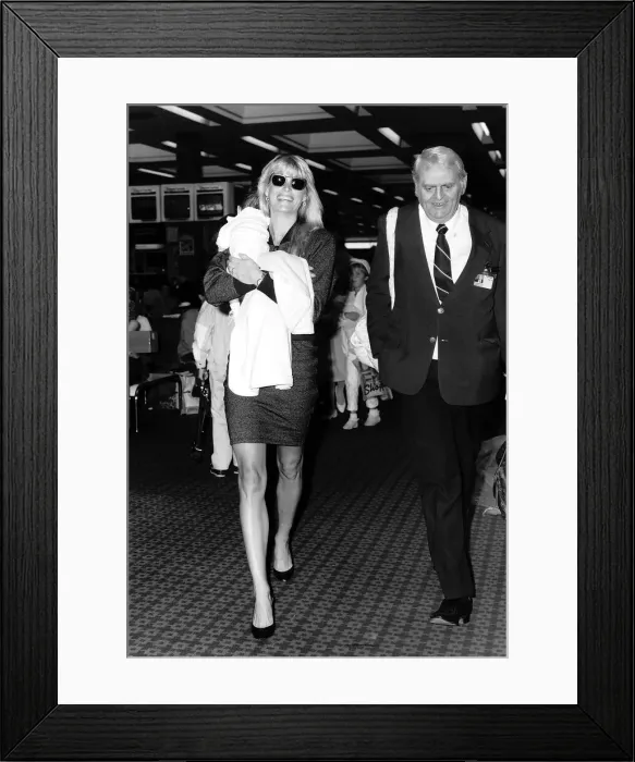 Framed Print : Kathy Emberg with daughter of Rod Stewart Ruby walking through Heathrow airport Framed Print : Kathy Emberg with daughter of Rod Stewart Ruby walking through Heathrow airport