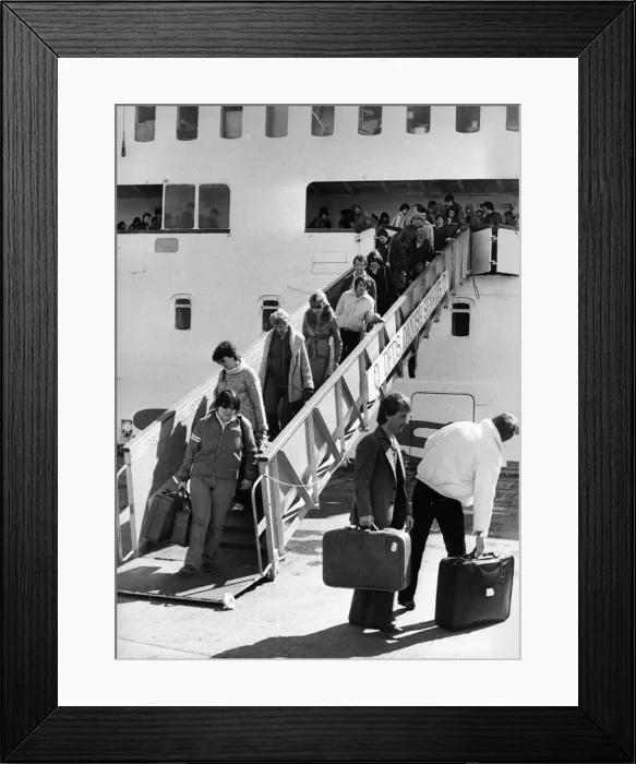 Framed Print : These holidaymakers look unhappy that their holiday is over Framed Print : These holidaymakers look unhappy that their holiday is over