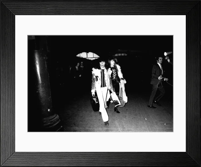 Framed Print : Rolling Stones: Bill Wyman & his girlfriend Astrid arrive at Newcastle Central Station Framed Print : Rolling Stones: Bill Wyman & his girlfriend Astrid arrive at Newcastle Central Station