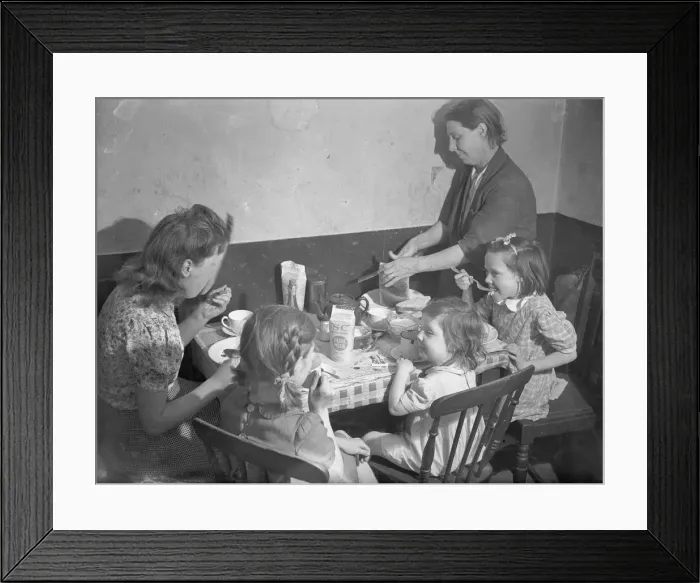 Framed Print : Tea time. The family gather around the kitchen table for a tea time meal. September 1946