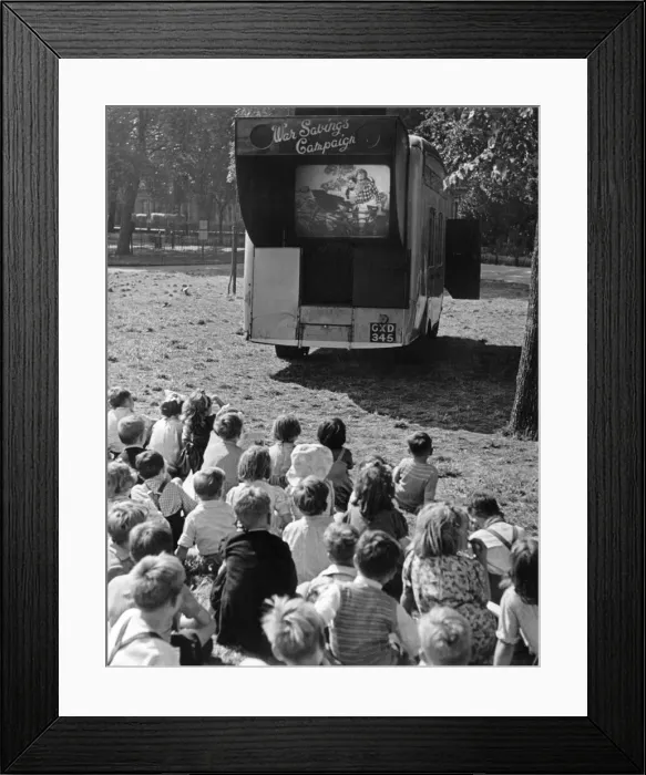 Framed Print : Children watch an open air cinema performance of Ralph Readers Gang Show Framed Print : Children watch an open air cinema performance of Ralph Readers Gang Show