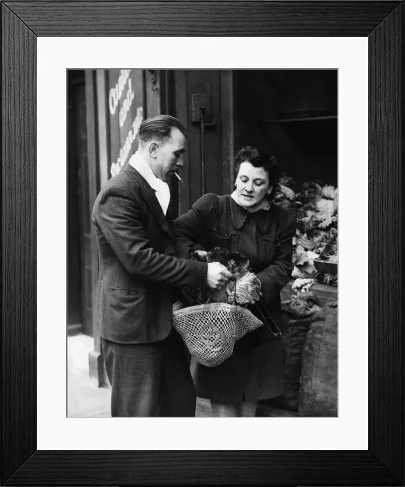 Framed Print : Private Ted Saunders of the 2nd Army out shopping with his wife Margaret in Bermondsey Framed Print : Private Ted Saunders of the 2nd Army out shopping with his wife Margaret in Bermondsey