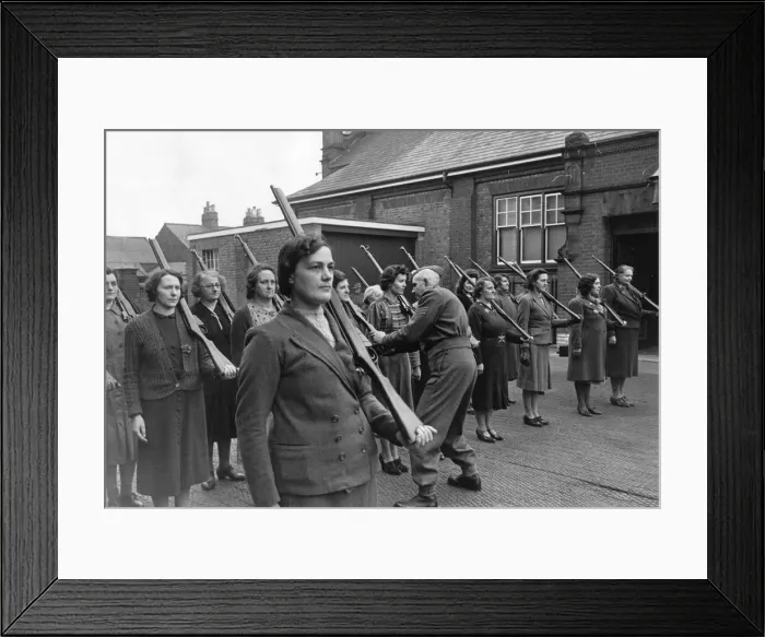 Framed Print : A Home Guard Sergeant giving women instructions on holding rifles during a drill