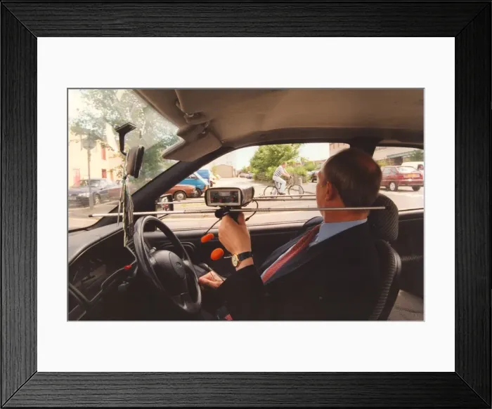 Framed Print : A police officer with a tracer device to track stolen bicycles Framed Print : A police officer with a tracer device to track stolen bicycles