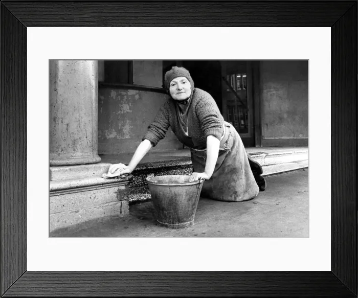Framed Print : Mrs. Bella Pyle cleaning the steps at Stanleys Pavilion Cinema which has been empty Framed Print : Mrs. Bella Pyle cleaning the steps at Stanleys Pavilion Cinema which has been empty