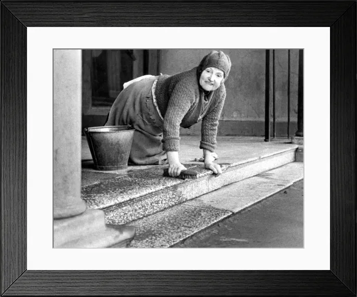 Framed Print : Mrs. Bella Pyle cleaning the steps at Stanleys Pavilion Cinema which has been empty Framed Print : Mrs. Bella Pyle cleaning the steps at Stanleys Pavilion Cinema which has been empty