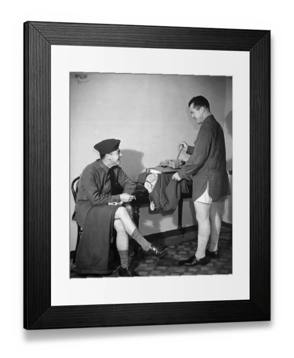 Framed Print : An American army soldier pressing his trousers before going to an American Club in