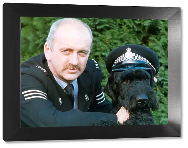 Police dog Kruger the Giant Schnauzer with his handler Paul Hedges