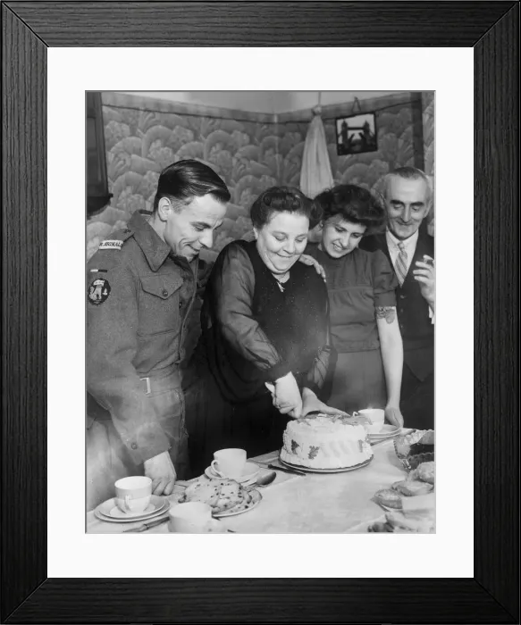 Framed Print : Signalman in the Royal Navy Andrew Cambpell about to eat a cake made for him by his
