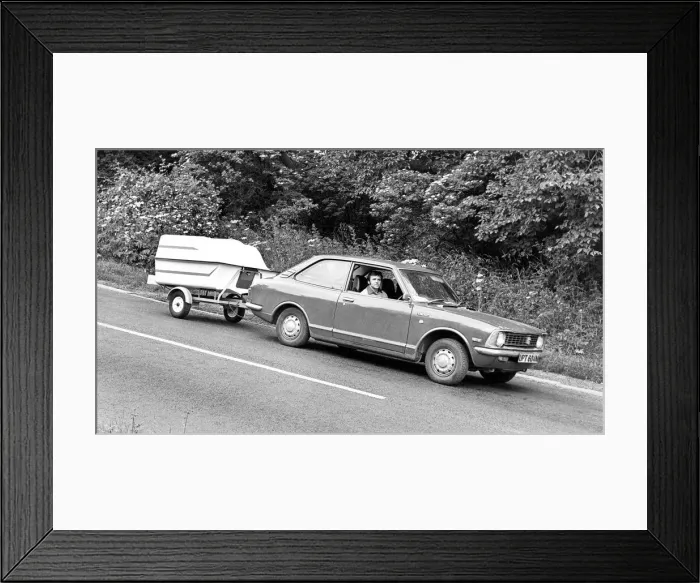 Framed Print : A man on holiday with his camping equipment in a state of the art trailer Framed Print : A man on holiday with his camping equipment in a state of the art trailer