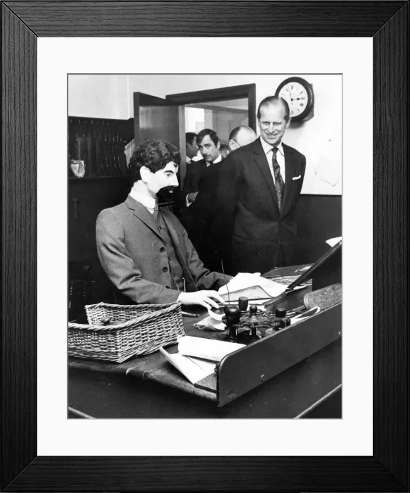 Framed Print : Prince Philip, Duke of Edinburgh, is met with a stony stare from the dummy behind Framed Print : Prince Philip, Duke of Edinburgh, is met with a stony stare from the dummy behind