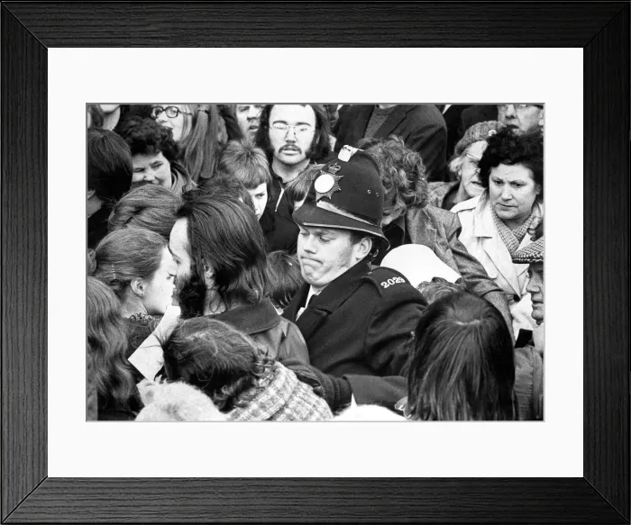 Framed Print : A policeman struggles with the crowd after Liberal party supporters tried to push through