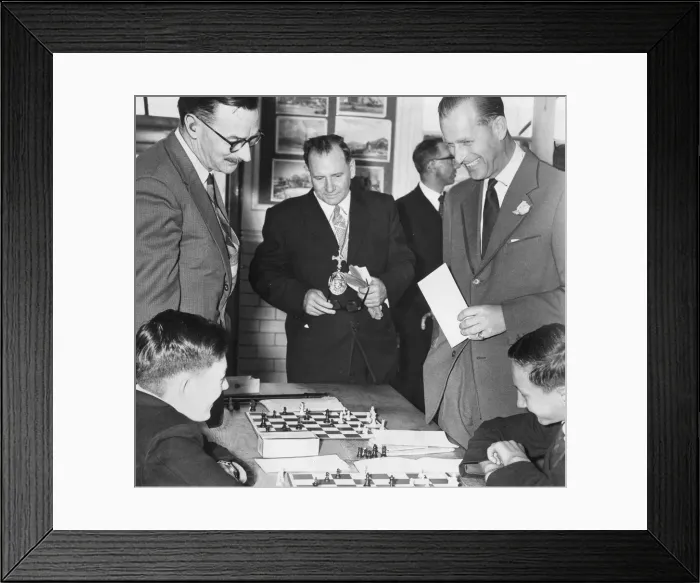 Framed Print : Prince Philip, Duke of Edinburgh, watches as Kenneth Wood, left Framed Print : Prince Philip, Duke of Edinburgh, watches as Kenneth Wood, left