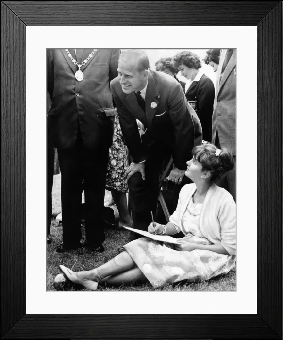 Framed Print : Prince Philip, Duke of Edinburgh, gets down to have a closer look at the work of Janet Framed Print : Prince Philip, Duke of Edinburgh, gets down to have a closer look at the work of Janet