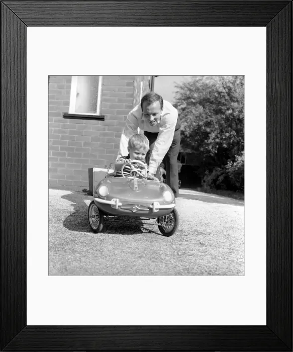 Framed Print : England Footballer Nobby Stiles seen here relaxing with his family