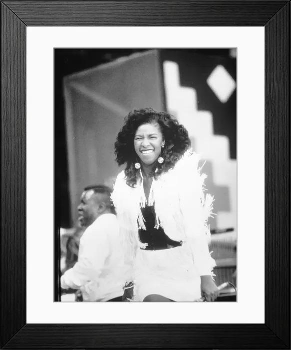 Framed Print : Natalie Cole singer daughter of the late Nat King Cole on stage during one of her Framed Print : Natalie Cole singer daughter of the late Nat King Cole on stage during one of her