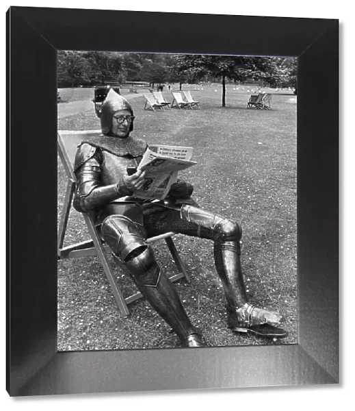 George young sunbathing in Green Park in a suit of Armour. August 1967 P014994