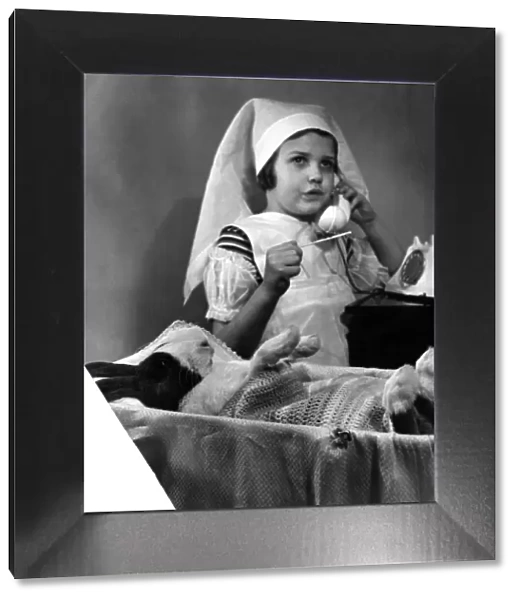 Children with animals: Blue Dutch rabbit. March 1952 P023310