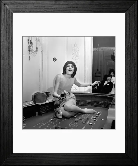 Framed Print : Singer Sandie Shaw has a flutter at a party she gave for shoe-retailers attending Framed Print : Singer Sandie Shaw has a flutter at a party she gave for shoe-retailers attending