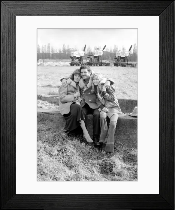 Framed Print : Filming Winter Rates'Cliff Robertson with his arms around the shoulders of