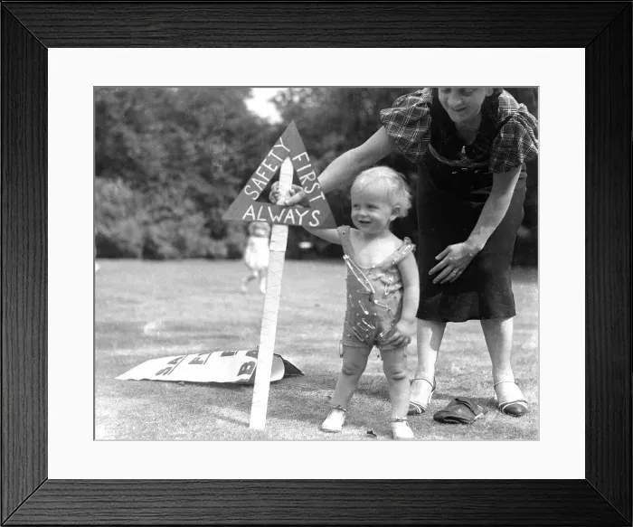 Framed Print : Mother and child covered in safety pins. 1st June 1935