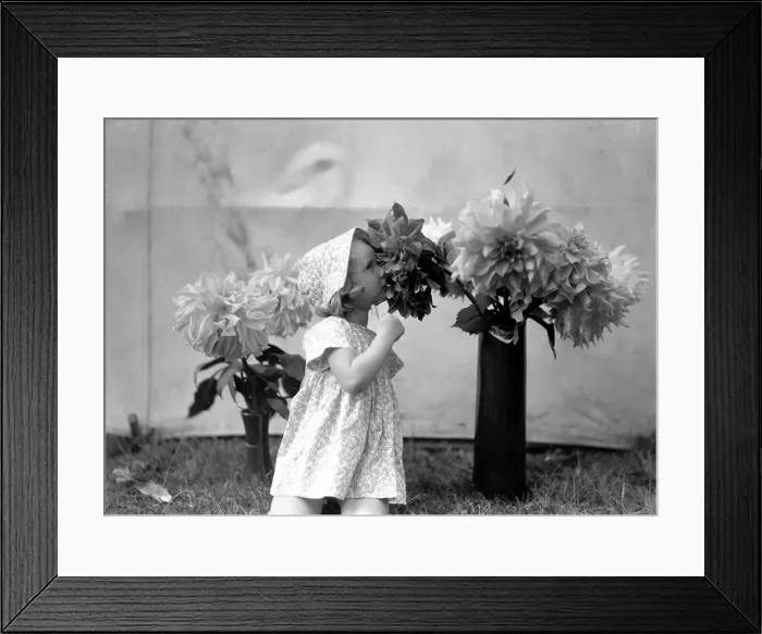 Framed Print : Girl and flowers. 1st June 1935