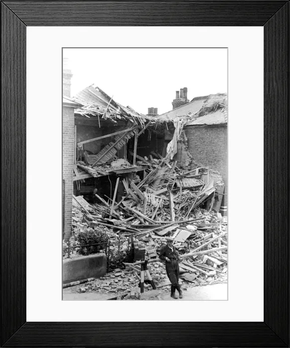 Framed Print : Alfieri. Air Raid damage, Malden. Man standing outside house which has taken a Framed Print : Alfieri. Air Raid damage, Malden. Man standing outside house which has taken a