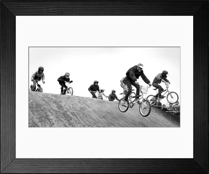 Framed Print : Young contestants over the obstacle in a BMX race at Windy Nook Framed Print : Young contestants over the obstacle in a BMX race at Windy Nook