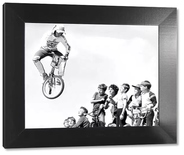 Startled BMX children watch as Pete Middleton demonstrates his skill