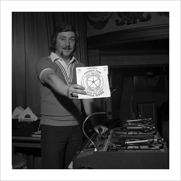 Wigan Casino dancers 1975 Northern Soul DJ Russ Winstanley holds up a 45 single