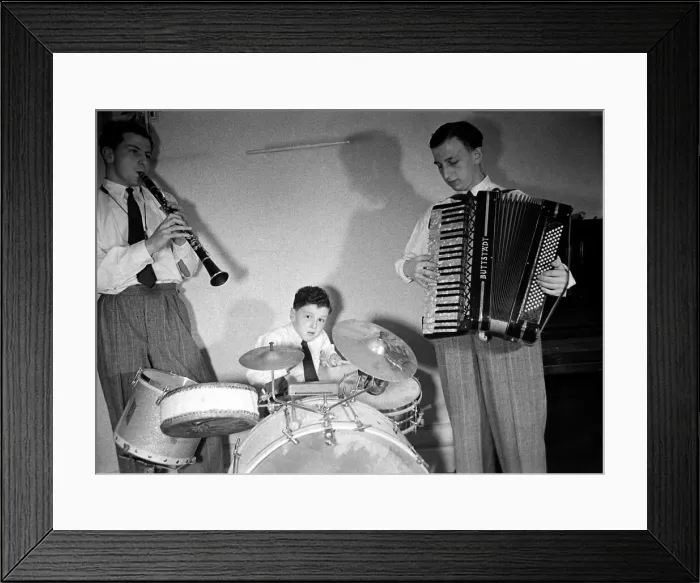 Framed Print : Boy musician Victor Feldman on his drum kit with band members playing the clarinet