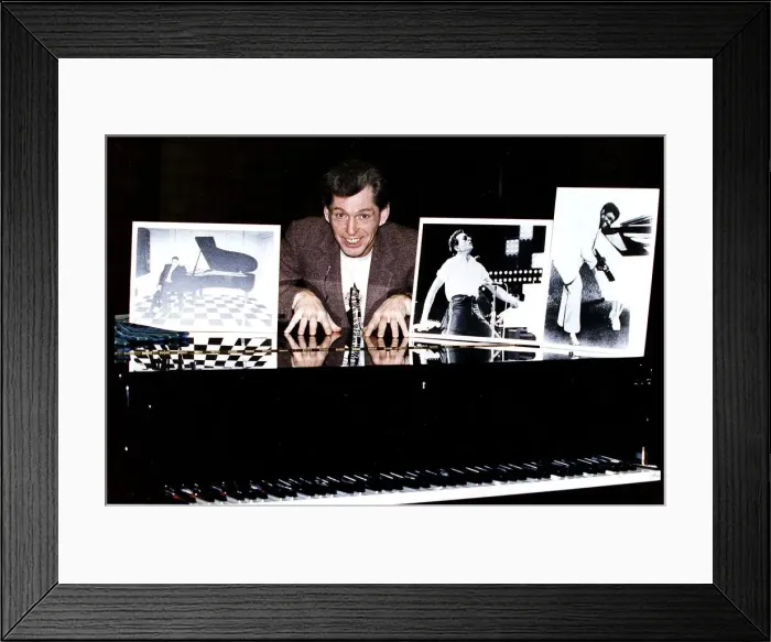 Framed Print : Georgie Fame singer behind grand piano with photograhs