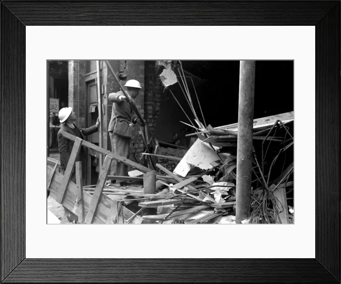 Framed Print : Alfieri. Air raid damage at Malden, London. Two civil volunteers search through Framed Print : Alfieri. Air raid damage at Malden, London. Two civil volunteers search through