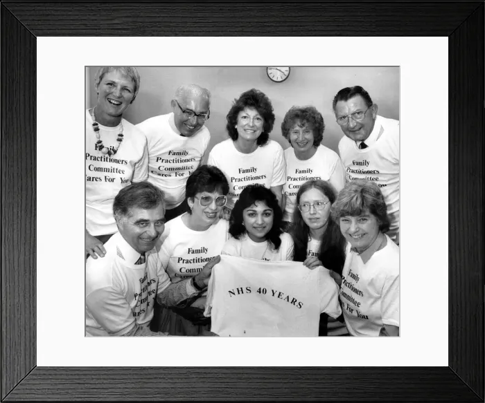 Framed Print : Staff at Coventrys Family Practitioner Committee show off the tee shirts chosen to