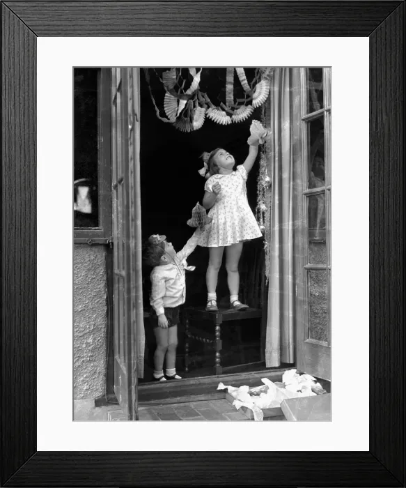 Framed Print : Alfieri. 1273. Child Studies-Hanging up Christmas decorations. Betty Graves and Keith Framed Print : Alfieri. 1273. Child Studies-Hanging up Christmas decorations. Betty Graves and Keith