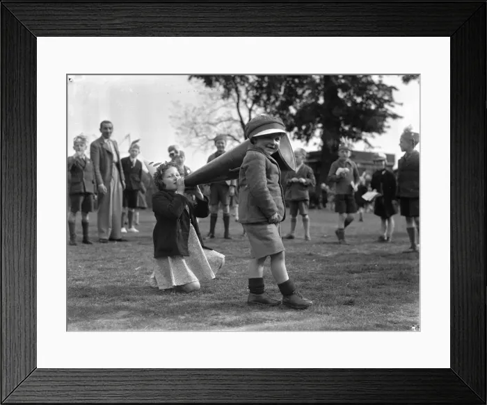 Framed Print : Brother and sister seen here playing with a giant megaphone at the Twickenham Garden Fete Framed Print : Brother and sister seen here playing with a giant megaphone at the Twickenham Garden Fete