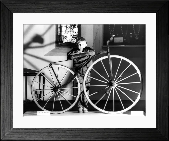 Framed Print : Gavin Snowdon aged 10, with a boneshaker, aged 107 at the Woodhorn Museum Framed Print : Gavin Snowdon aged 10, with a boneshaker, aged 107 at the Woodhorn Museum