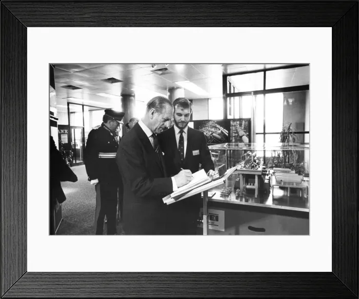 Framed Print : Prince Philip, Duke of Edinburgh, signs the visitors Framed Print : Prince Philip, Duke of Edinburgh, signs the visitors