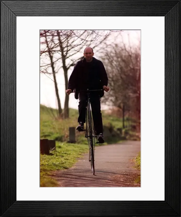 Framed Print : A man on his penny farthing Framed Print : A man on his penny farthing