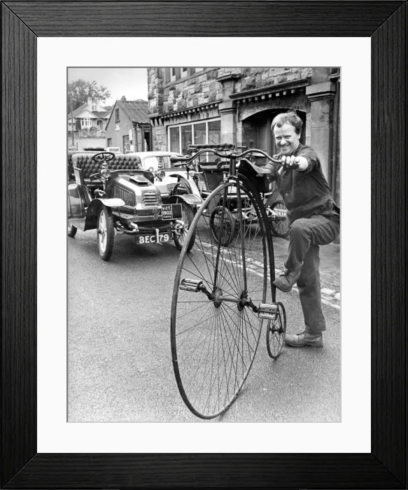 Framed Print : John Potter in from of his Kirby Stephen Museum with a penny farthing Framed Print : John Potter in from of his Kirby Stephen Museum with a penny farthing
