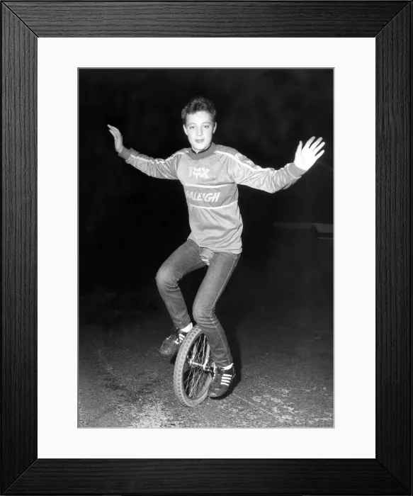 Framed Print : Schoolboy stunt rider Neil Cliff on his unicycle Framed Print : Schoolboy stunt rider Neil Cliff on his unicycle