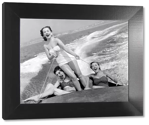 Out on the ocean waves, August 1954 3 girls go for a spin on a speedboat in