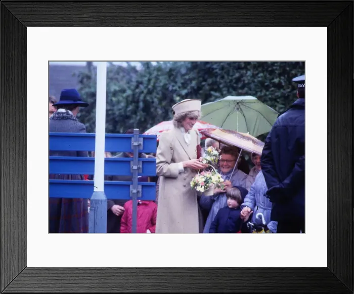 Framed Print : Princesss Diana Princess of Wales, wearing a cream hat and coat holding flowers Framed Print : Princesss Diana Princess of Wales, wearing a cream hat and coat holding flowers