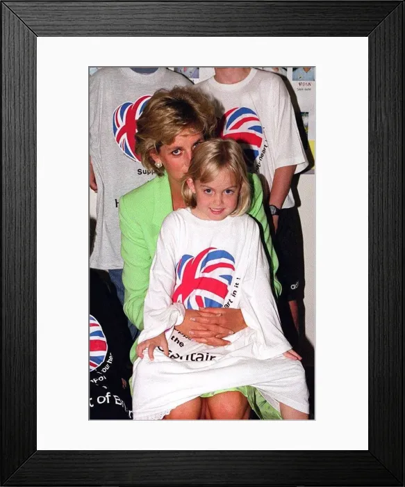 Framed Print : Princess Diana sitting with Jessica Waugh on her lap during a visit to a children